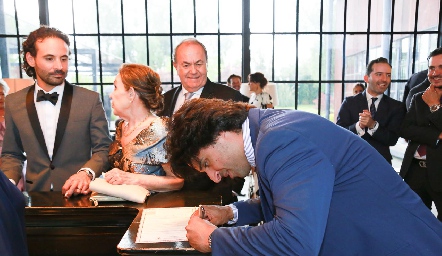  Samuel Romo firmando como testigo.